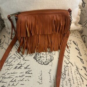 Brown pleather fringe purse, cross body straps, brass detailing, black lining